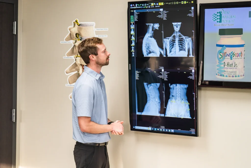 Dr. Britton Goldsmith looking over patient x-rays