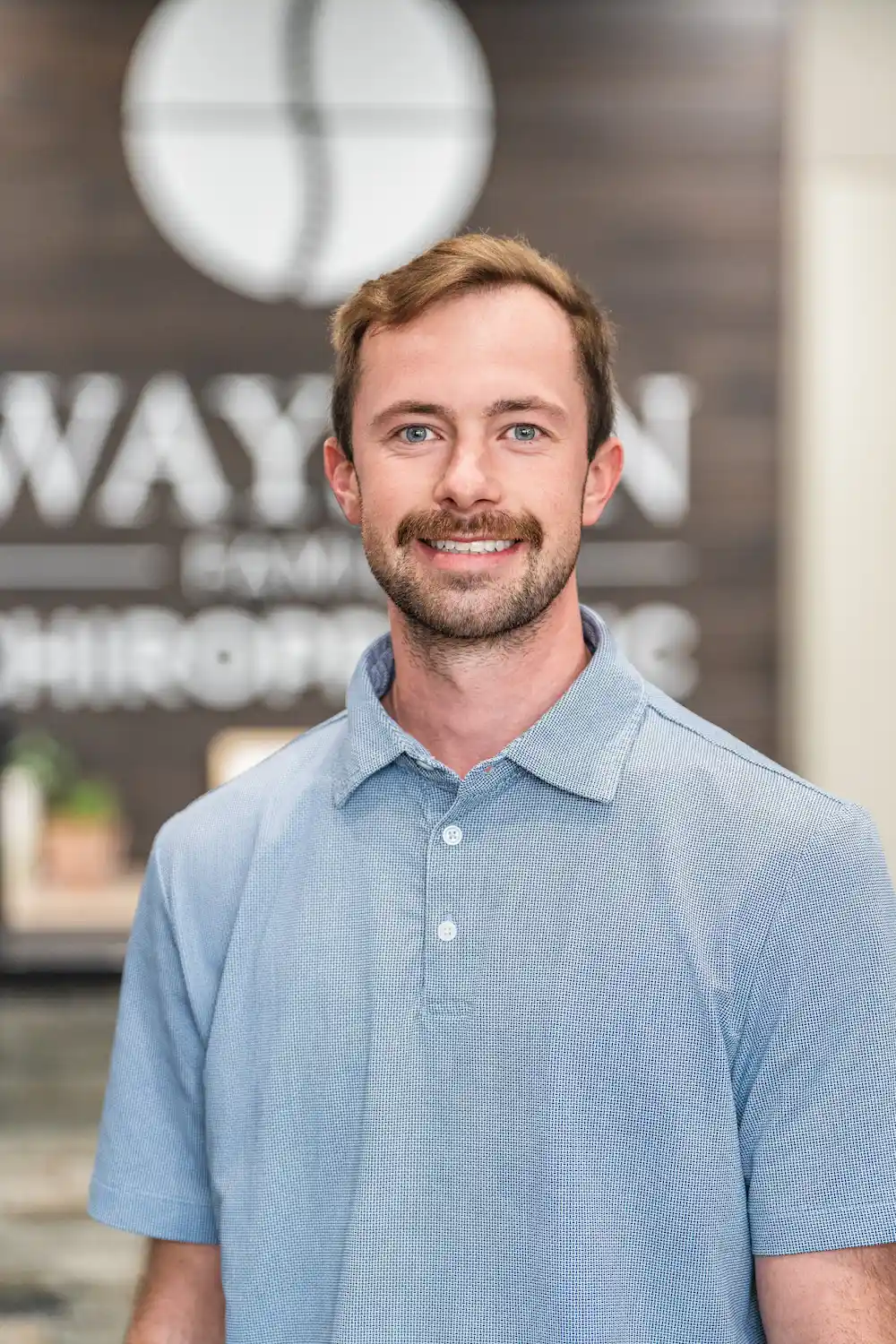 Dr. Britton Goldsmith smiling looking at camera for a professional picture