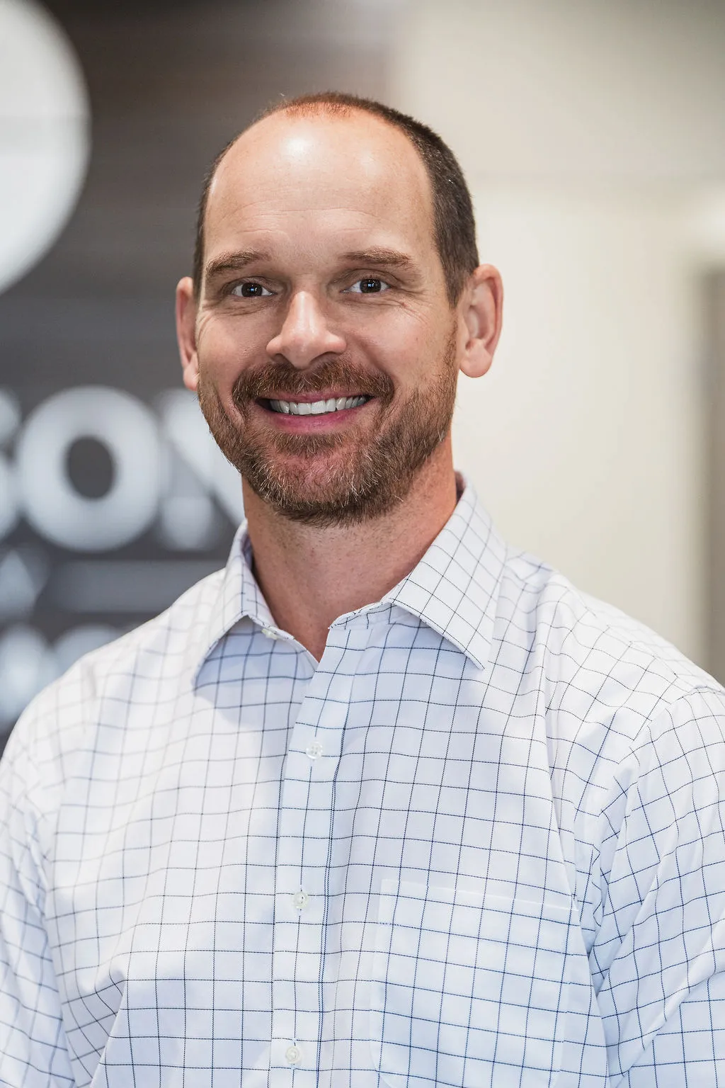 Dr. Blake Wayson of Wayson Family Chiropractic smiling at camera