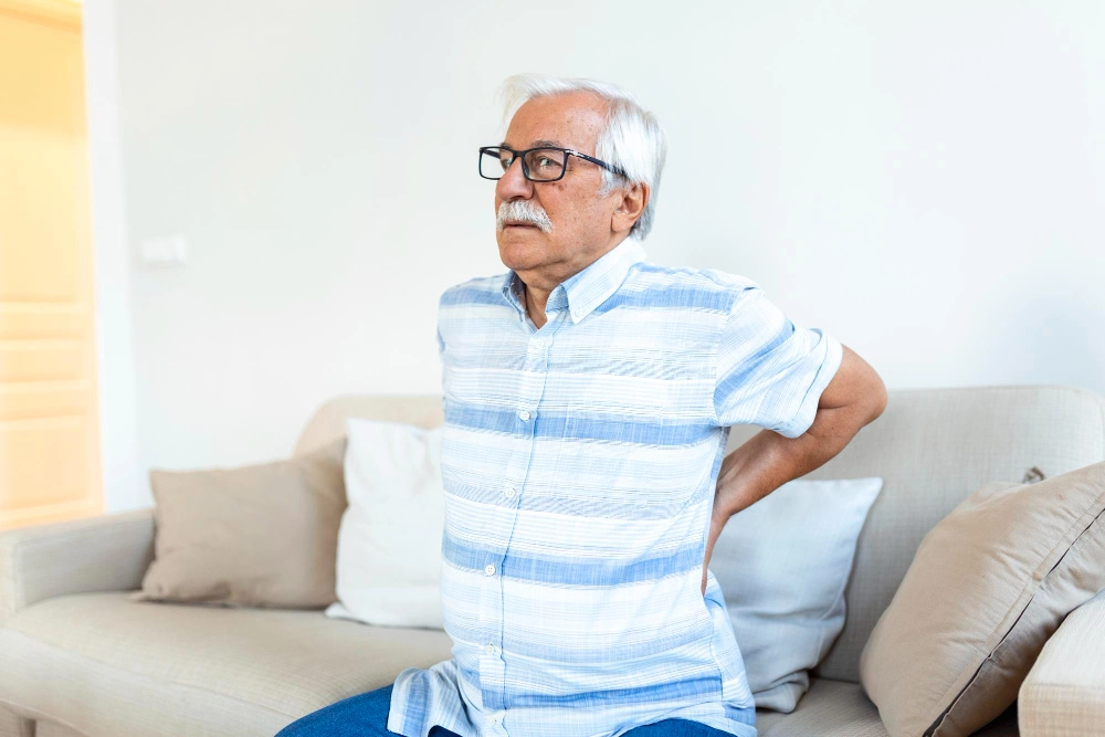 Chiropractor providing gentle care to senior patient