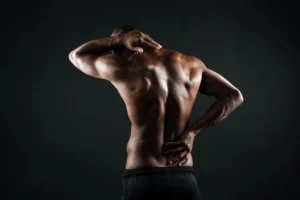 Man suffering from lower back pain while standing
