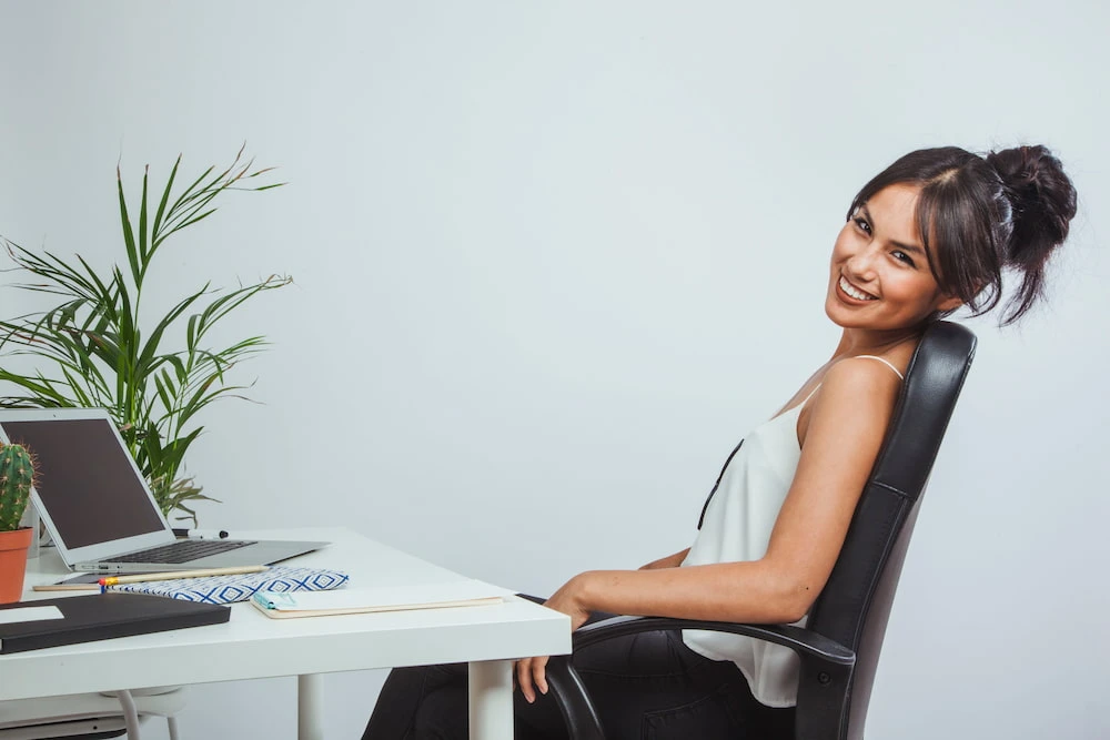 Office worker sitting with slouched posture in chair