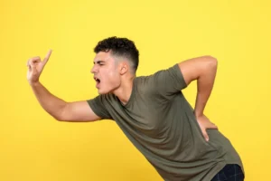 Teen using smartphone with poor posture causing text neck